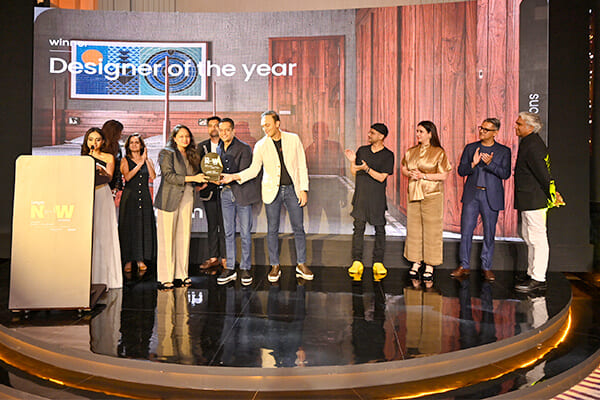 Winner of Designer of the year receiving trophy