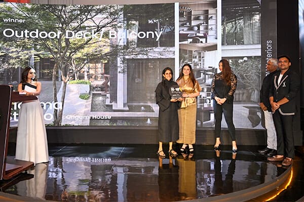 Winner of Outdoor Deck - Balcony receiving trophy
