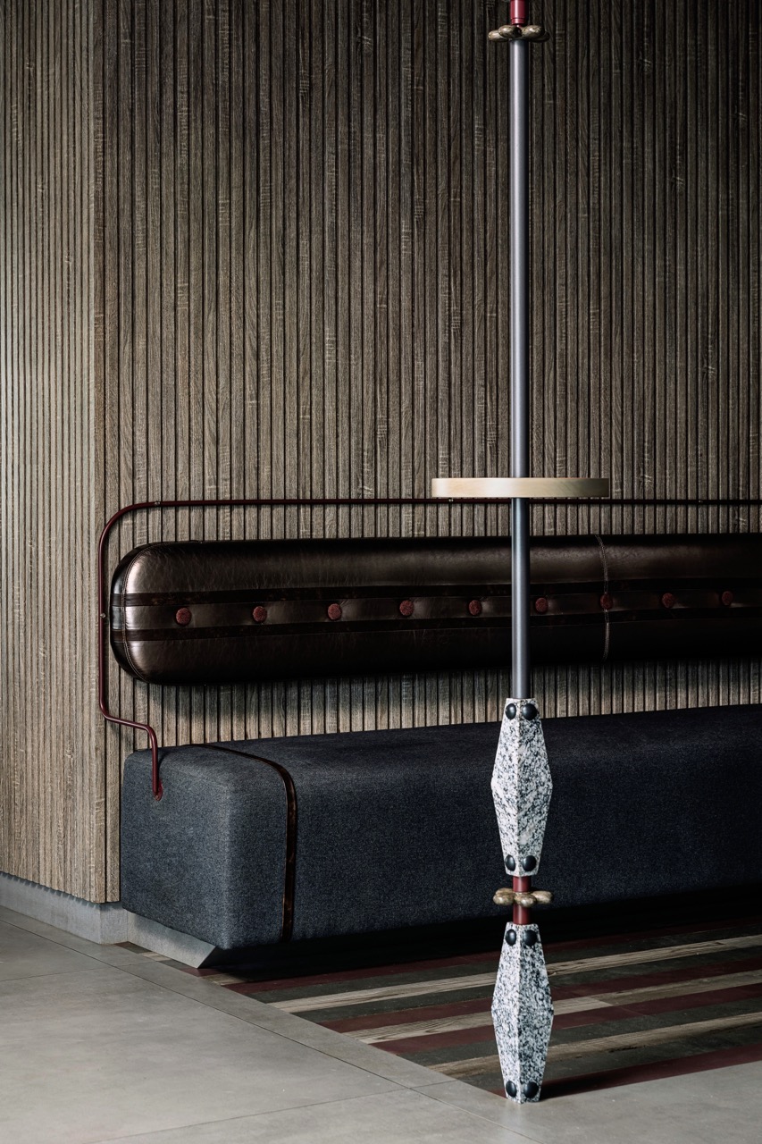 The comfortable English pub-style seating for the bar area features a metallic bronze backrest