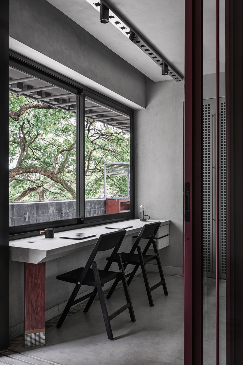 The home office is a tranquil spot to work while looking out at the surrounding trees