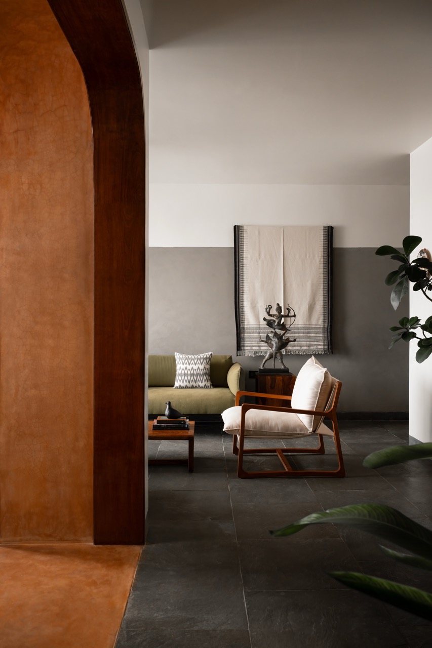 A hanging traditional textile and a spiritual sculpture at the entrance welcome you, adding warmth and character as the house unfolds