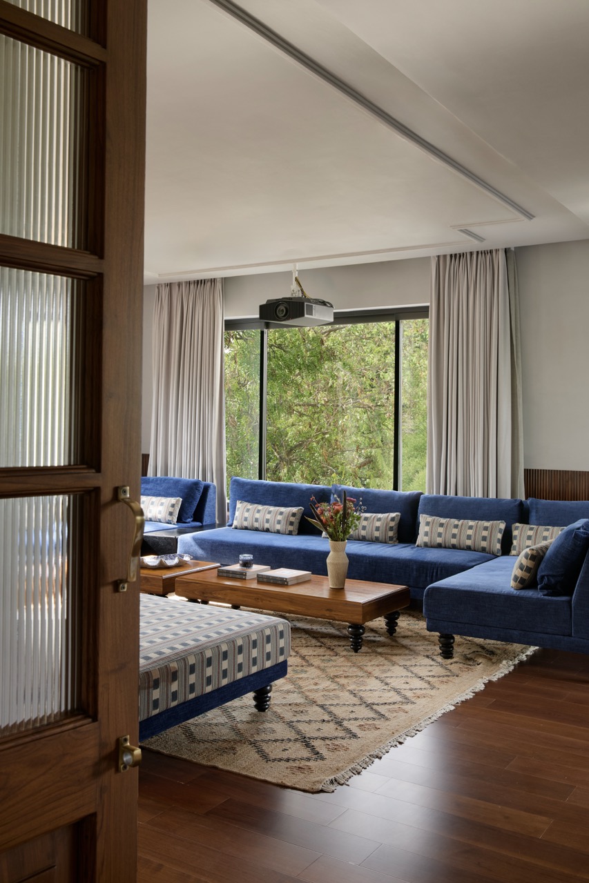 The lounge blends comfort and style with Dastkari furniture dressed in Studio Orion fabrics, set atop a Home Neera rug and Natural Elements wooden flooring. Curtains by Drapes N’ More complete the look