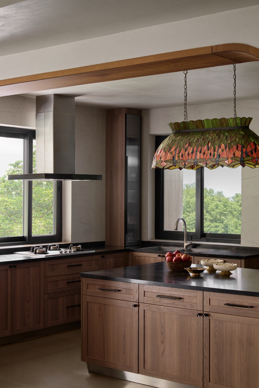 Brass artefacts from the client’s collection add character to the Scasa kitchen, while an island light from The Hesperus Store illuminates the space