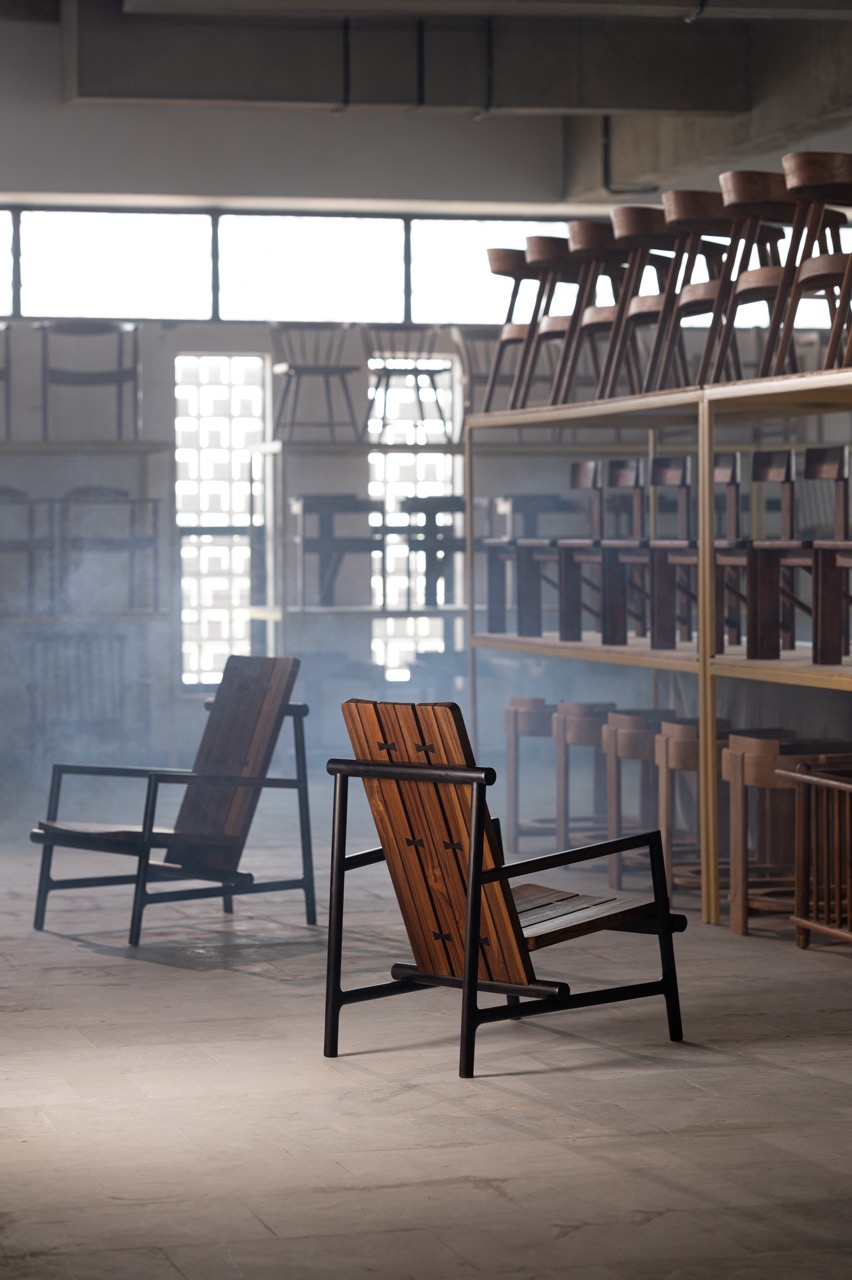 The Cleave arm chair in reclaimed teak with a natural finish and rosewood accents